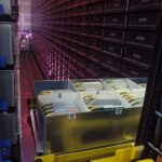 Picture showing a Automated Storage and Retrieval System (ASRS) located at the Defense Visual Information Center. Source: https://commons.wikimedia.org/wiki/File:Automated_Storage_and_Retrieval_System_-_Defense_Visual_Information_Center_%C2%B7_DD-ST-96-00253.JPEG